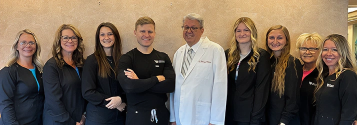 Orthodontist Daniel Wright & George Walker With Team Members
